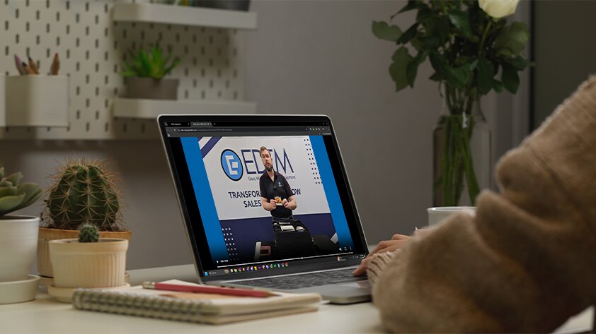 Window film sales kit course video playing on a laptop